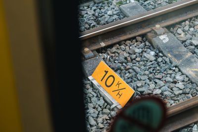 Close-up of text on railroad tracks