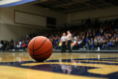 Basketball sits on a floor during a time-out.