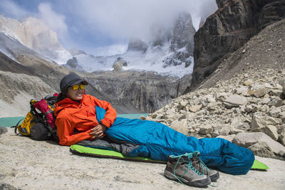 Female hiker camping out at torres del paine national park