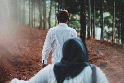 Rear view of man in forest