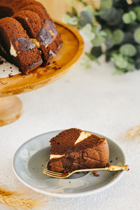 Homemade chocolate cake with sweet tasty in beautiful wooden plate