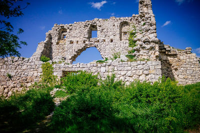 Low angle view of old ruin building