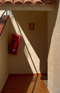 Close-up of fire extinguisher on wall