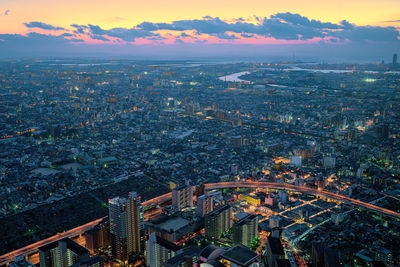 High angle view of city against cloudy sky