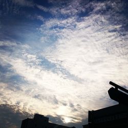 Low angle view of building against cloudy sky