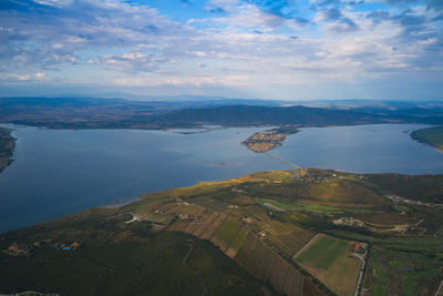 Aerial view of landscape and lake against sky