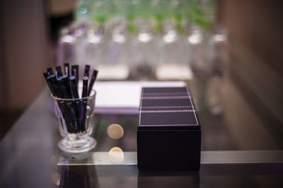 Close-up of wine glasses on table