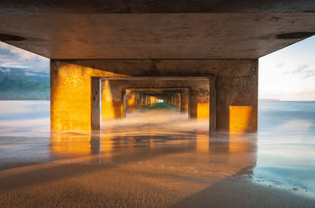 Underneath view of bridge over sea