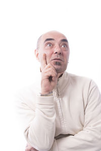 Portrait of mid adult man against white background