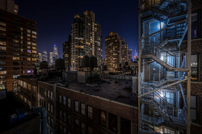 Illuminated buildings in manhattan at night