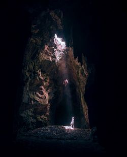 Man standing in cave