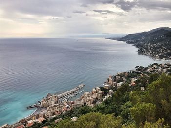 High angle view of sea and buildings against sky