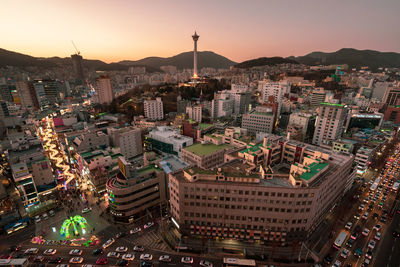 High angle view of buildings in city against sky during sunset