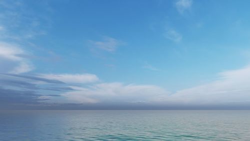 Scenic view of sea against blue sky