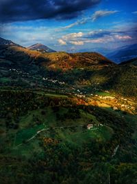 Scenic view of landscape and mountains against sky