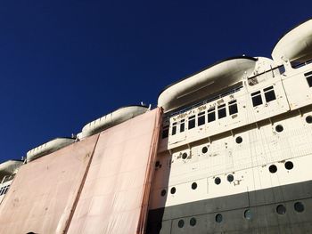 Low angle view of building against blue sky