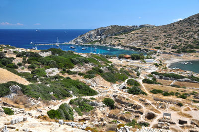 Scenic view of sea and mountains against sky