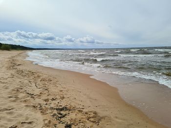 Scenic view of beach against sky