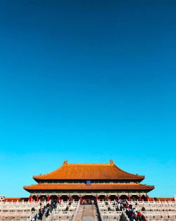 View of temple against clear blue sky