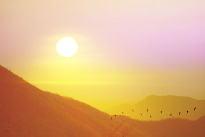 Scenic view of silhouette landscape against sky during sunset