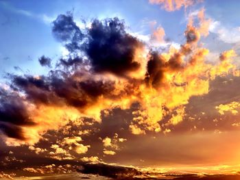 Low angle view of dramatic sky during sunset