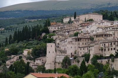 High angle view of townscape by mountain