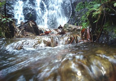 Close-up of waterfall against rocks