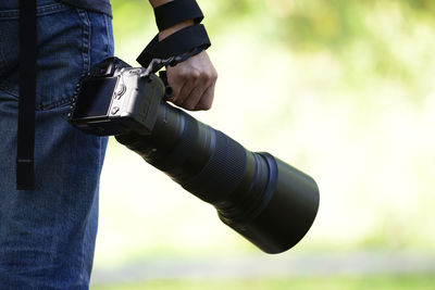 Close-up of man holding camera