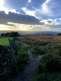 Scenic view of field against sky during sunset