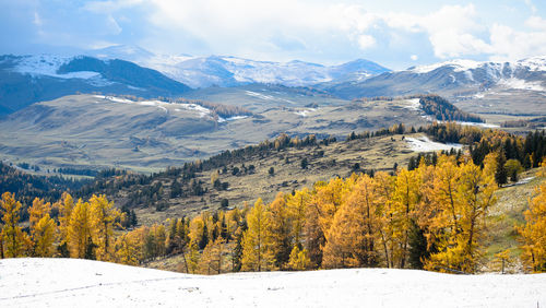 Scenic view of mountains against sky during winter