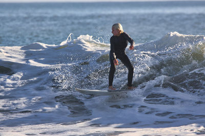 Full length of man standing in sea