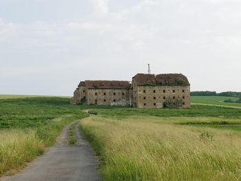 Castle on field against sky