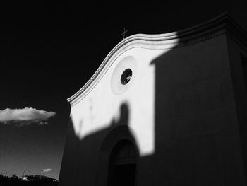 Low angle view of cross against sky at night