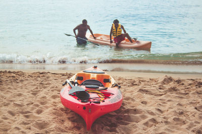 Young couple sitting on beach