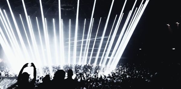 People enjoying music concert at night