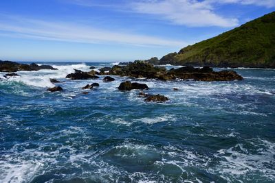 Scenic view of sea against blue sky