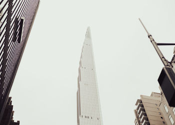 Low angle view of skyscrapers against clear sky