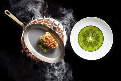 High angle view of food on table against black background