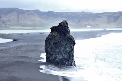 Scenic view of sea against sky during winter