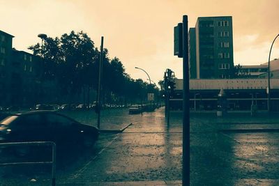 Buildings in city at sunset