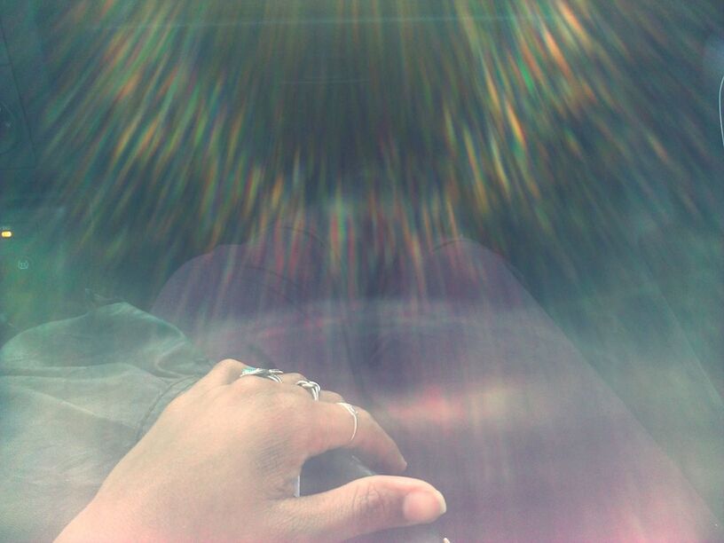 person, part of, personal perspective, human finger, cropped, lifestyles, holding, unrecognizable person, leisure activity, close-up, men, sunlight, lens flare, outdoors, day