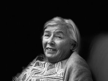 Portrait of smiling woman in darkroom