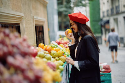 Side view of woman looking at market