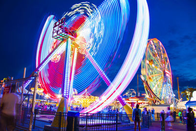 Low angle view of ferris wheel at night