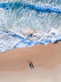 High angle view of surf on beach