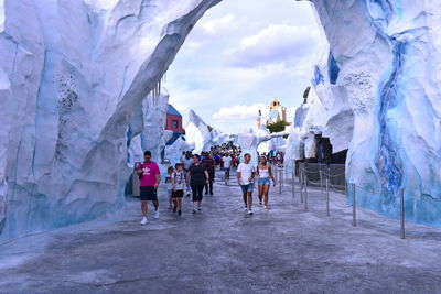 Group of people walking in town square