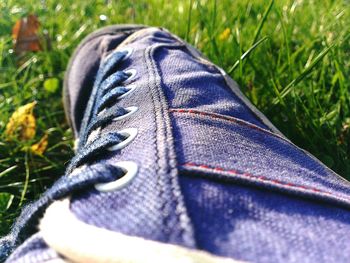 Low section of shoes on footpath