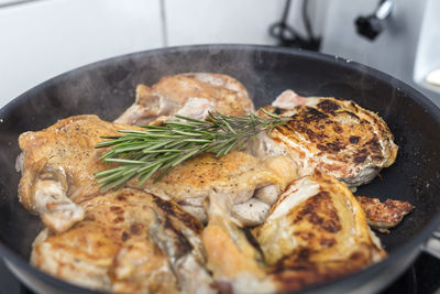 Close-up of meat in cooking pan