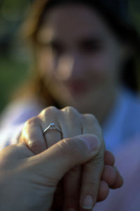 Close-up of couple holding hands