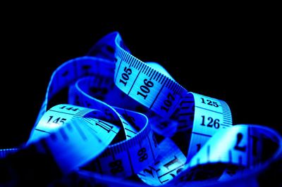 Close-up of blue object over black background